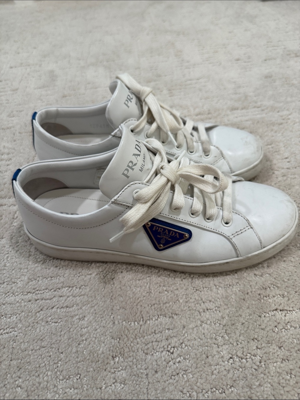 Prada White Leather Sneakers with Blue Logo Accent